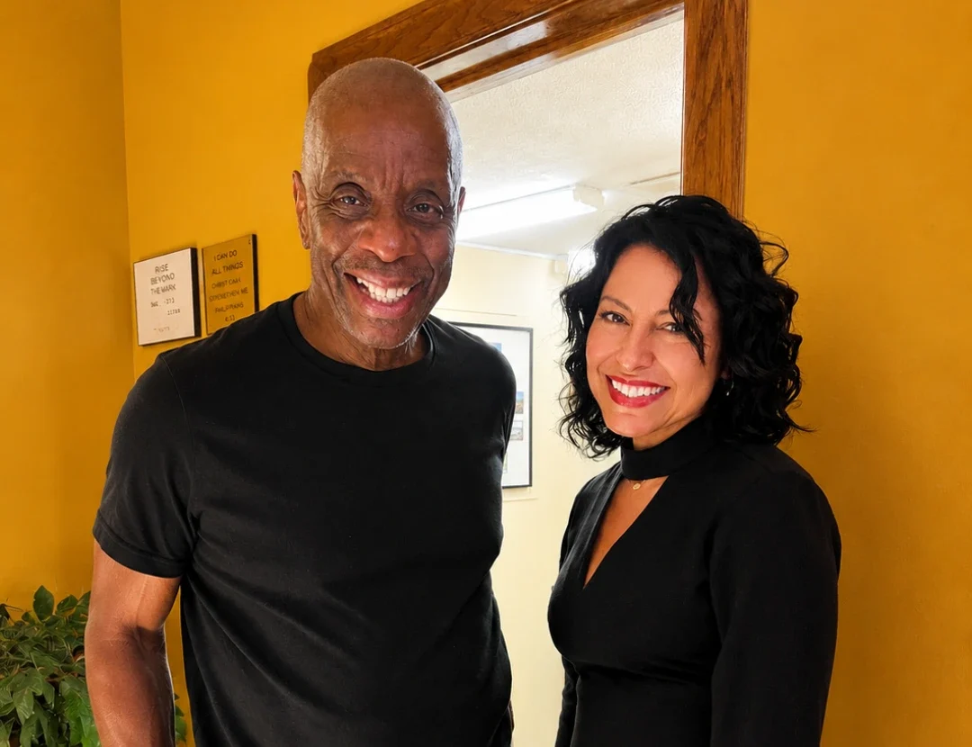 Mariza Brussolo posing with comedian Jimmie Walker at a comedy event in Florida